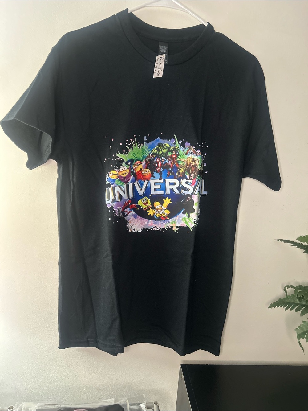 Universal Black Tee with Colorful Character Collage